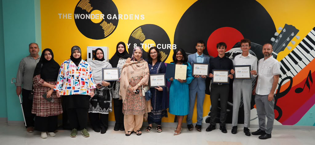Vanguard students honored with certificates at a community event